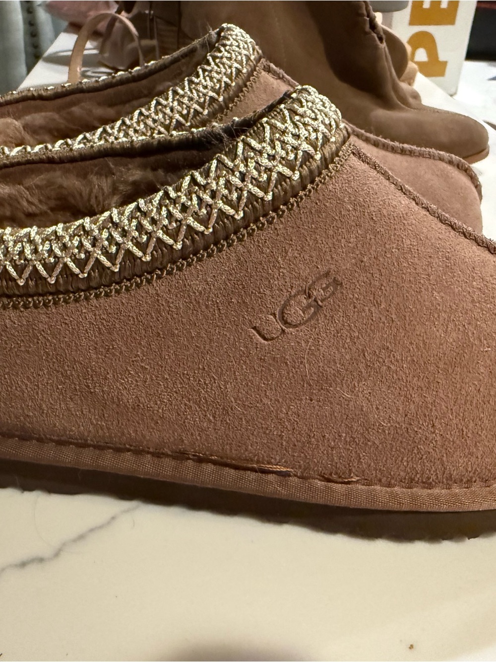 UGG Women's Chestnut Suede Slip-On with Gold Braided Trim